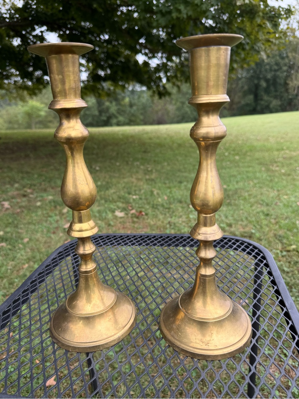 pair of vintage turned solid brass taper candlestick holders